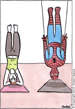 A lady at a yoga class in a headstand position (Sirsasana), while Spiderman in the same position using his spider-web strings